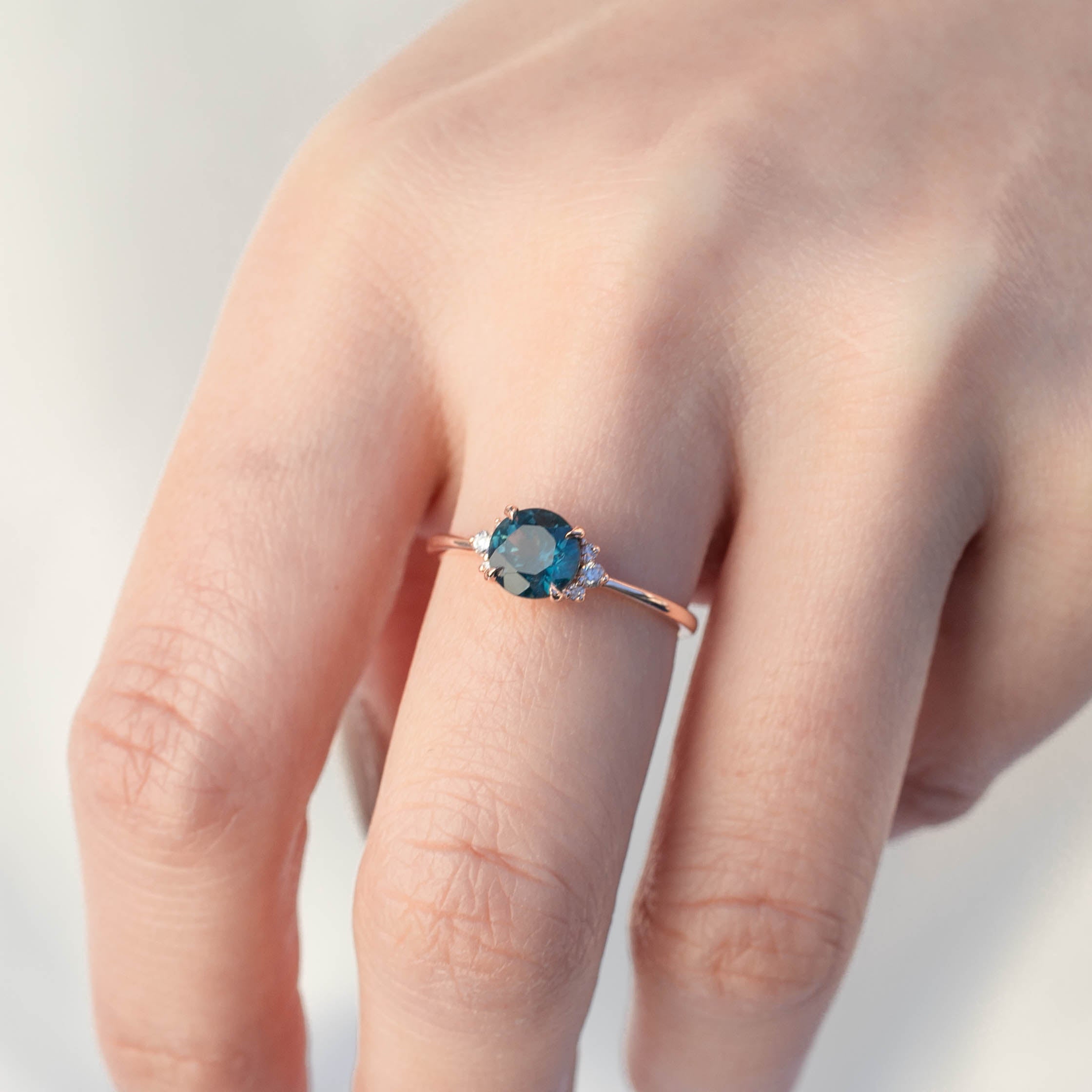 Lena Ring featuring a 1.17ct teal Montana sapphire in 14k rose gold, handmade and ethically sourced by Envero Jewelry.