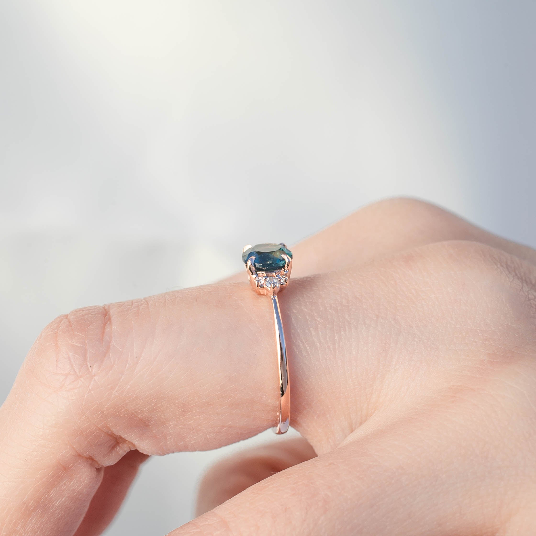 Lena Ring with 1.17ct teal Montana sapphire and diamonds in 14k rose gold, handmade and ethically sourced.