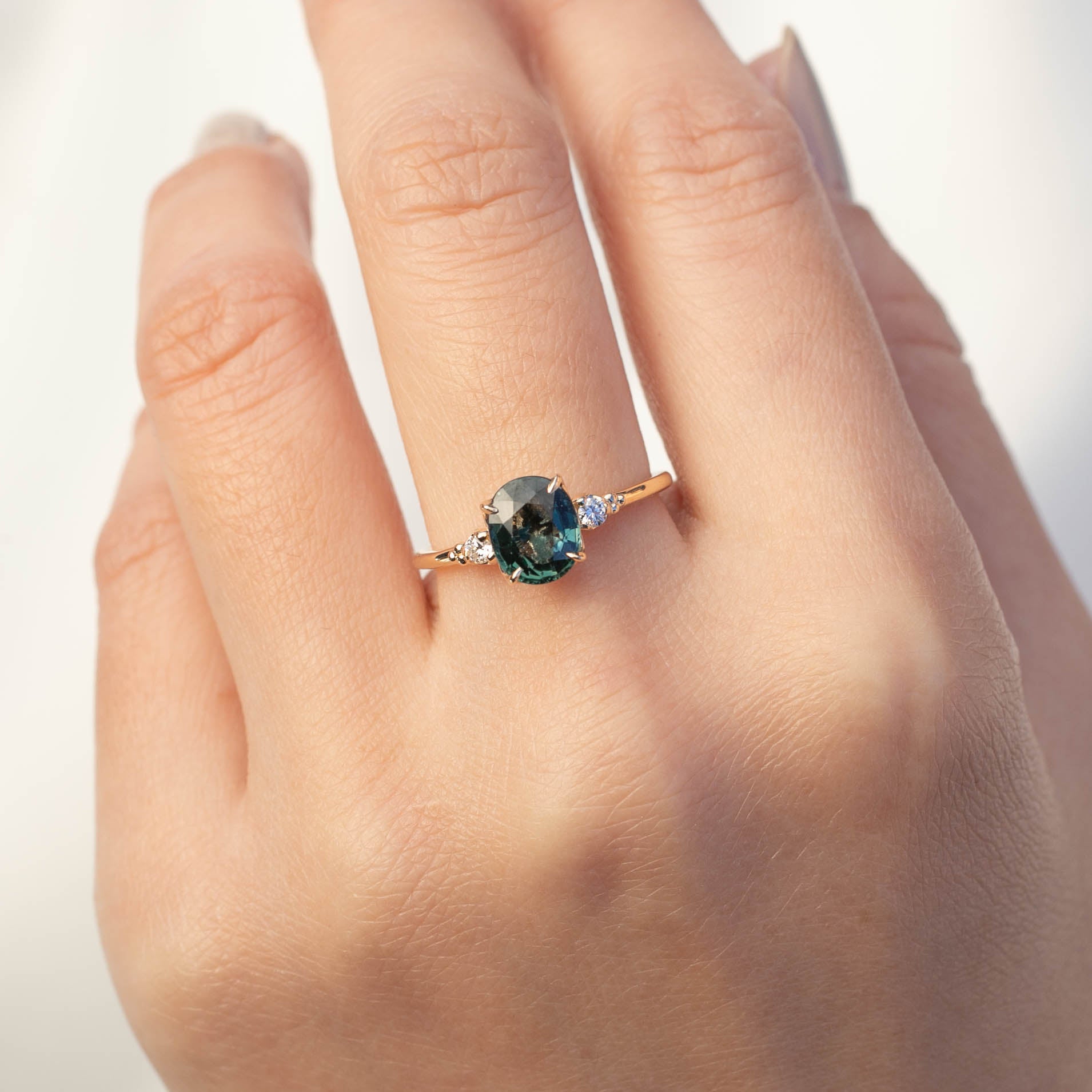 Estel Ring - 1.93ct Green Sapphire, handmade in recycled 14k gold with ethically sourced stones, shown on hand model.
