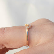 Bella's Crown Ring featuring natural white diamonds, ethically sourced gold, and a delicate 1.5mm band worn on finger.