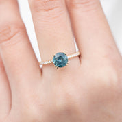 Sabrina Ring featuring a 1.79ct teal blue sapphire in recycled 14k gold with white diamond accents, handmade one of a kind