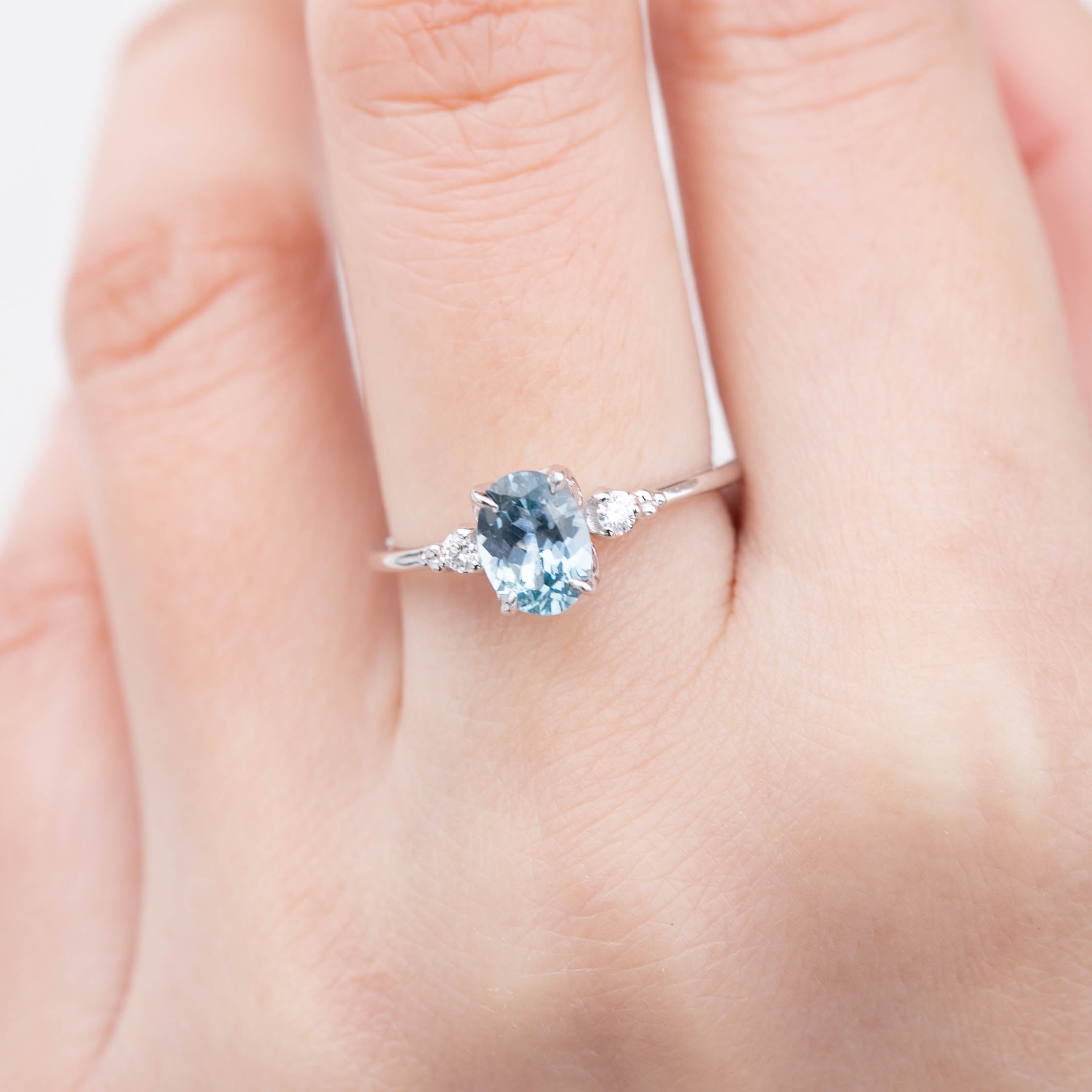 Elegant Estel Ring featuring a 1.36ct light blue Montana Sapphire in a four-prong flower setting on a 14k white gold band.