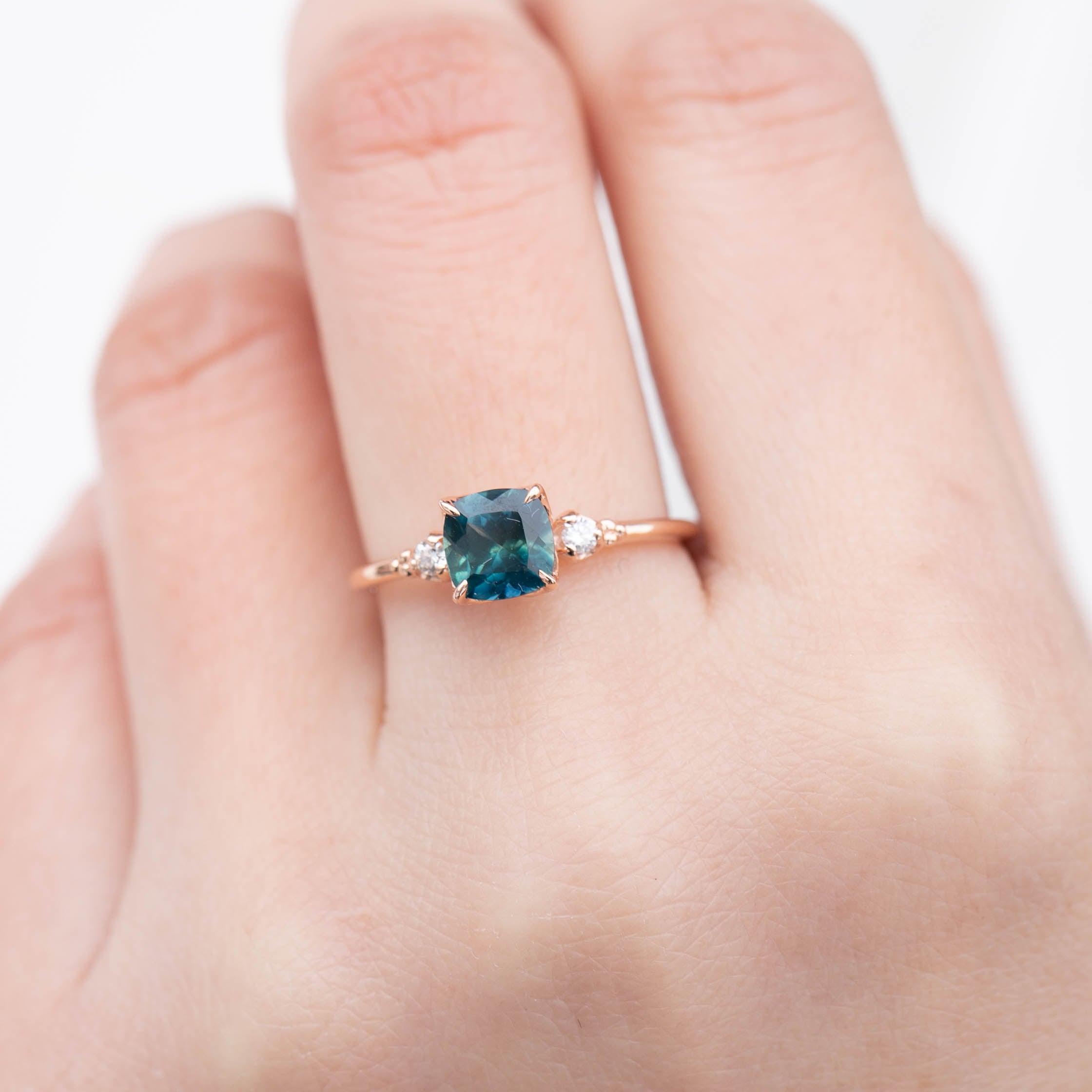 Estel Ring with 1.31ct cushion cut dark teal Montana sapphire in recycled 14k rose gold, handmade and one of a kind.