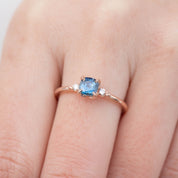 Close-up of Estel Ring featuring 0.76ct cushion Montana sapphire with diamond accents in 14k rose gold band