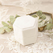 White velvet hexagonal ring box with grosgrain ribbon detail, perfect for engagement ring presentation and gifting.
