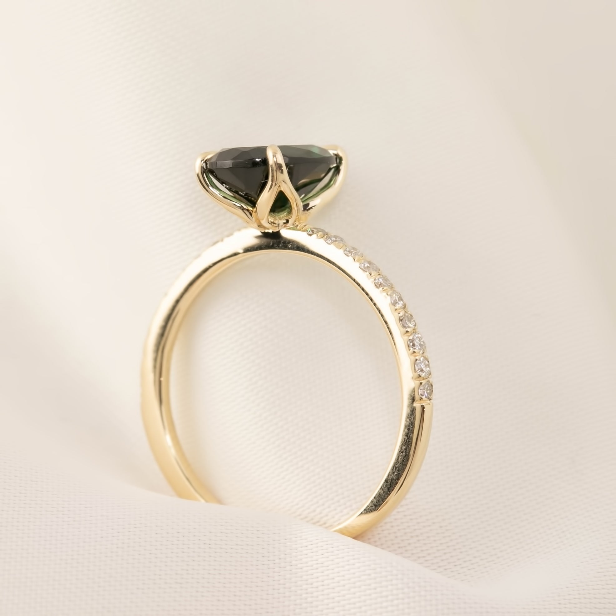 14k yellow gold ring with 1.53ct unheated oval green Queensland sapphire and natural accent diamonds