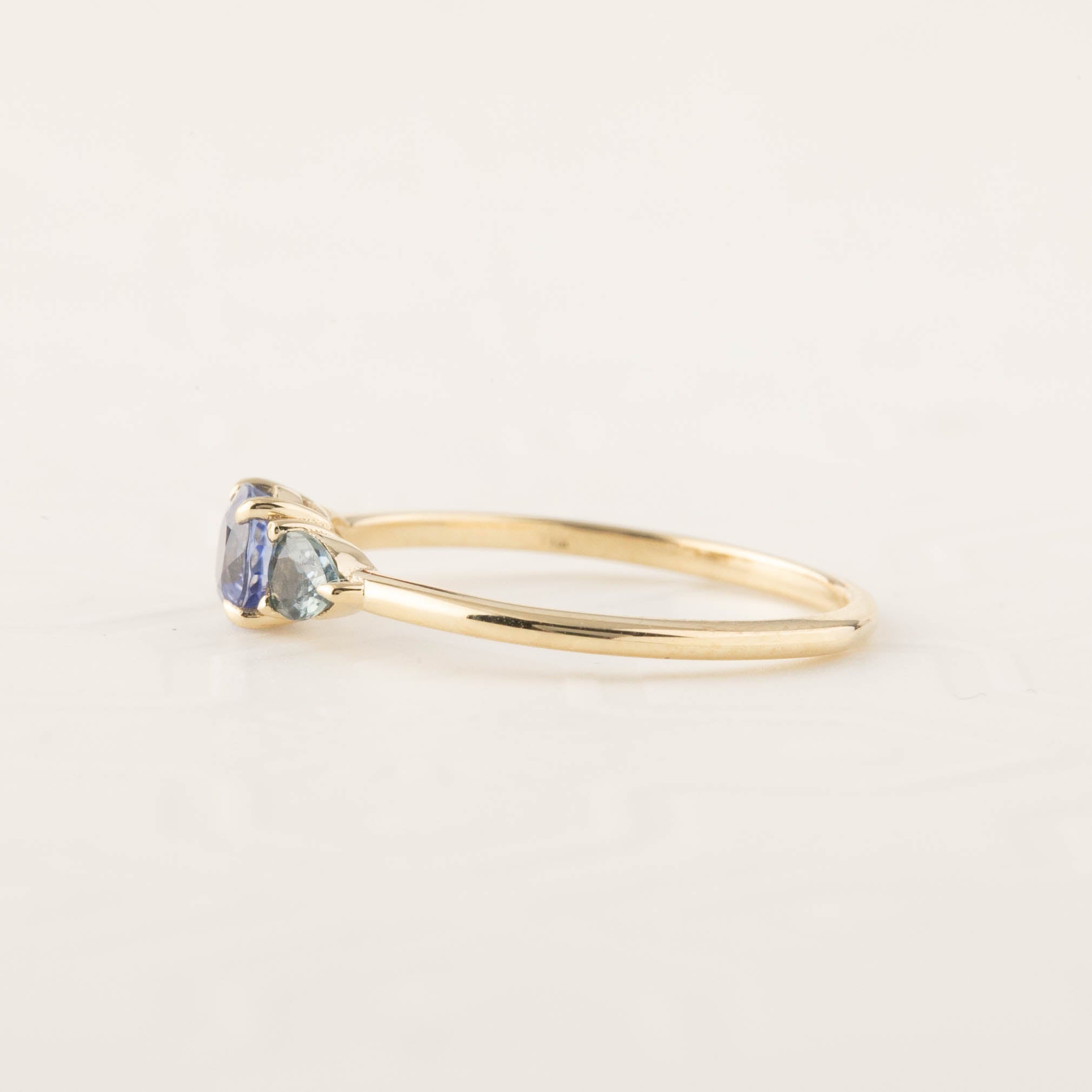 Side view of Olivia Ring with 0.5ct Ceylon blue sapphire and 14k recycled gold low profile prong setting
