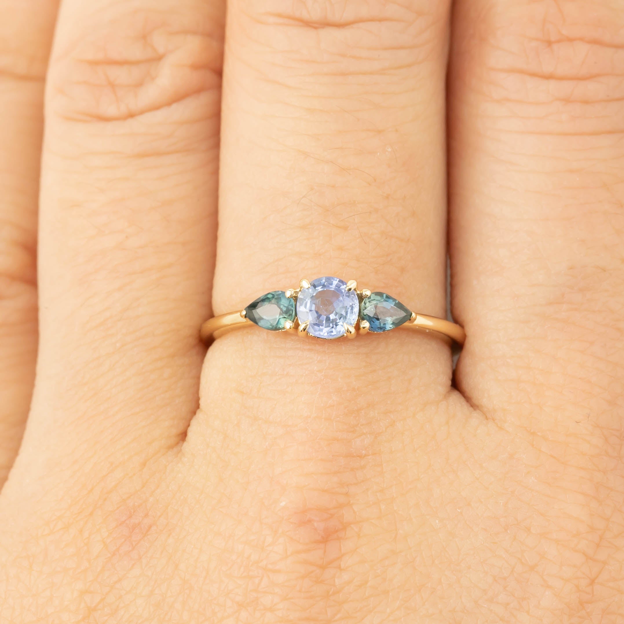 Olivia Ring with 0.5ct Ceylon blue sapphire center and 0.4ctw unheated teardrop sapphire side stones in 14k gold