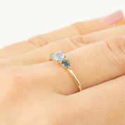 Gold ring with 0.5ct Ceylon blue sapphire and 0.4ct unheated teardrop sapphires on finger