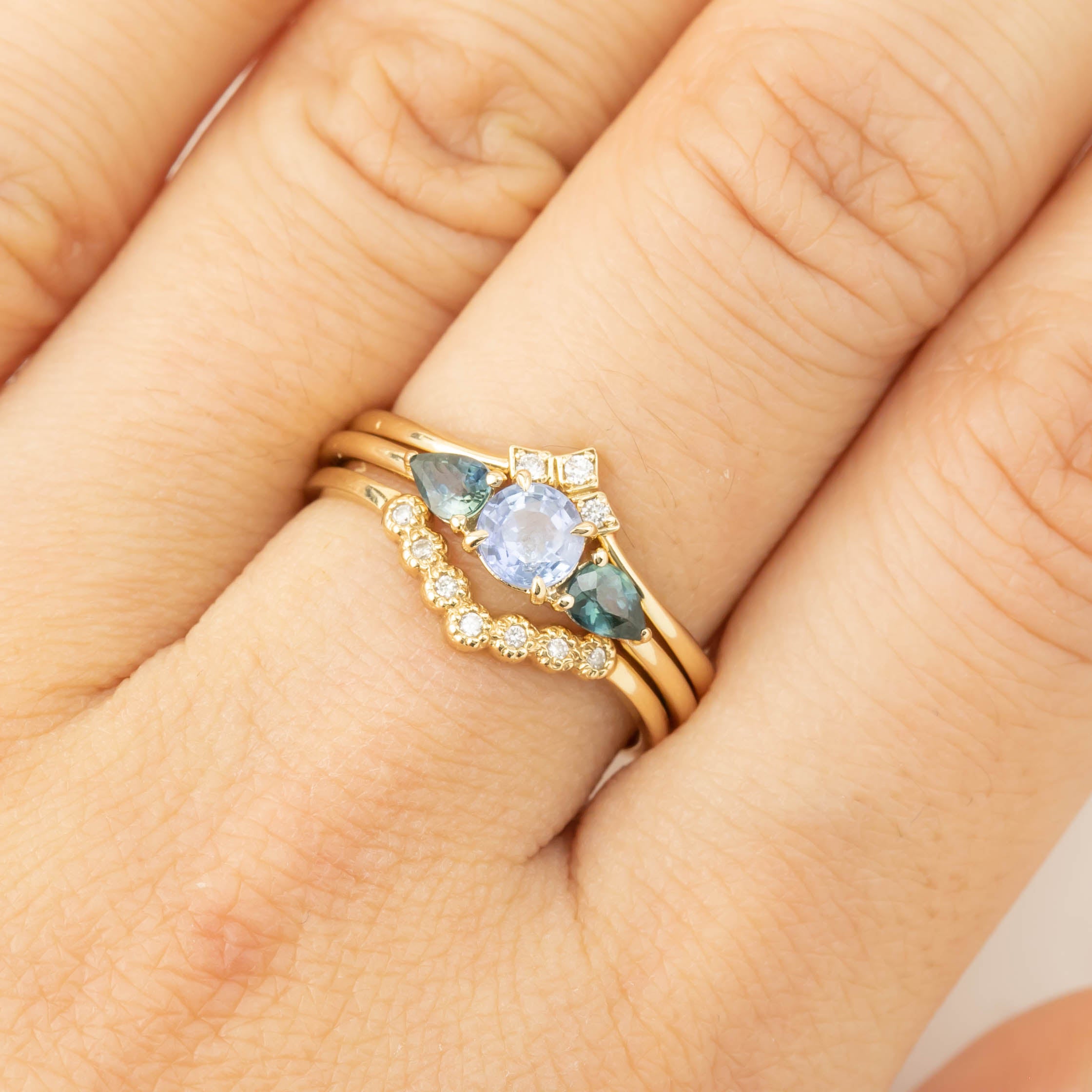 Olivia Ring featuring 0.5ct Ceylon blue sapphire with 0.4ctw teardrop sapphires set in recycled 14k gold band