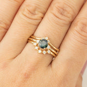 Gold ring with 0.75ct Queensland Peacock Sapphire and white diamonds on finger, size US 7, unique design