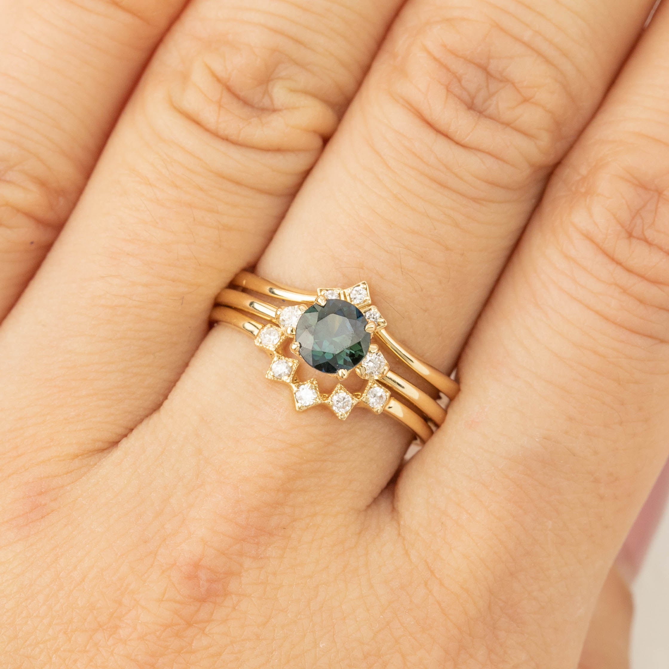 Gold ring with 0.75ct Queensland Peacock Sapphire and white diamonds on finger, size US 7, unique design