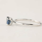 Sara Ring with 1.00ct blue green Montana sapphire in 14k white gold, classic 4 prong setting, delicate tapered band