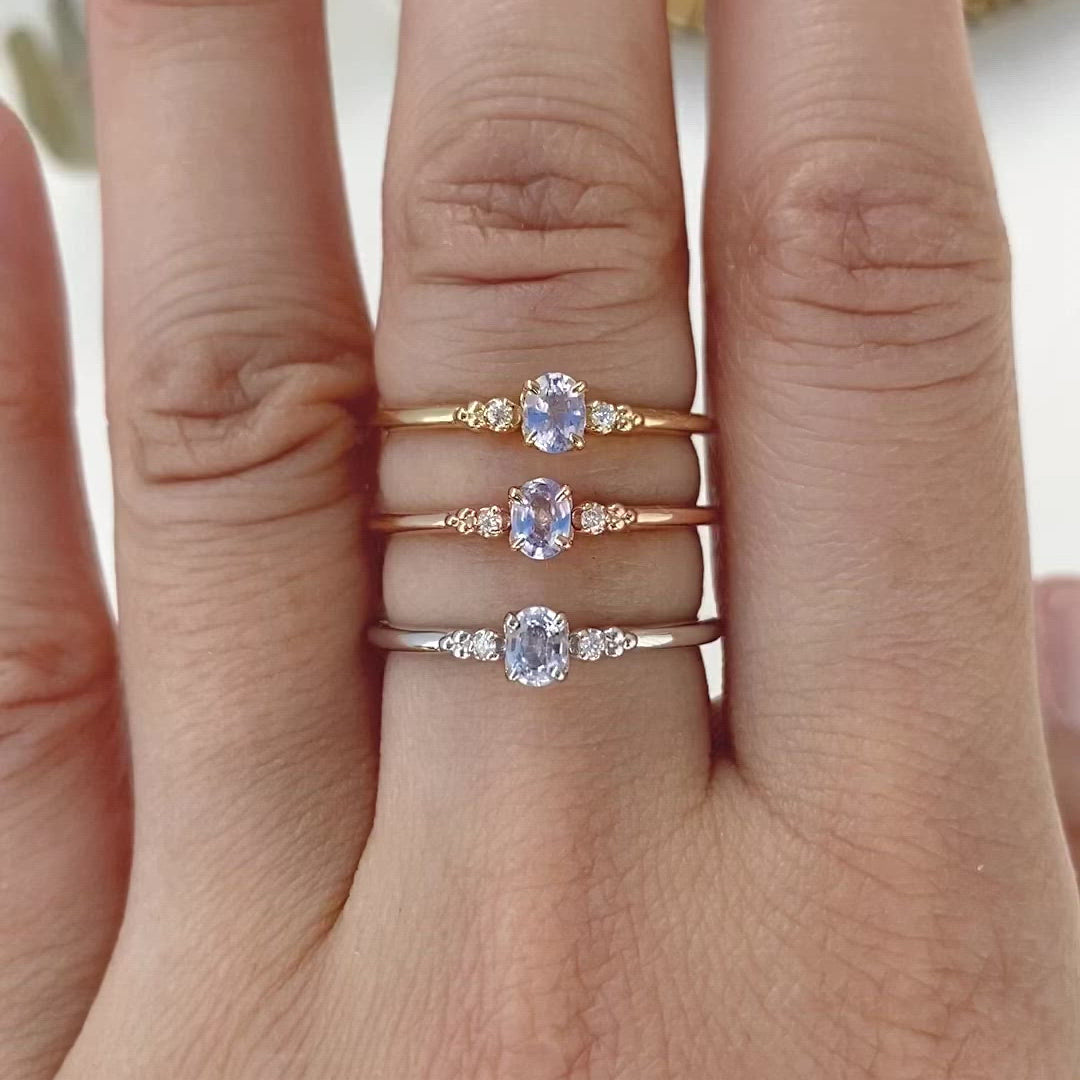 Three Estel Ring featuring a 0.20ct light blue unheated oval sapphire and 14k gold diamond accents