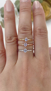 Three Estel Ring featuring a 0.20ct light blue unheated oval sapphire and 14k gold diamond accents
