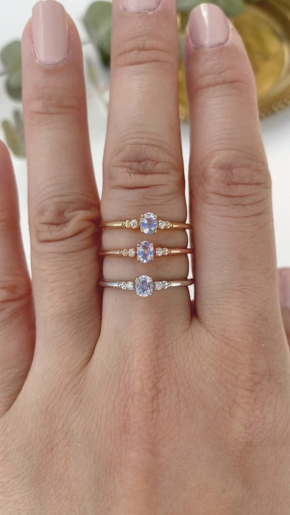 Three Estel Ring featuring a 0.20ct light blue unheated oval sapphire and 14k gold diamond accents
