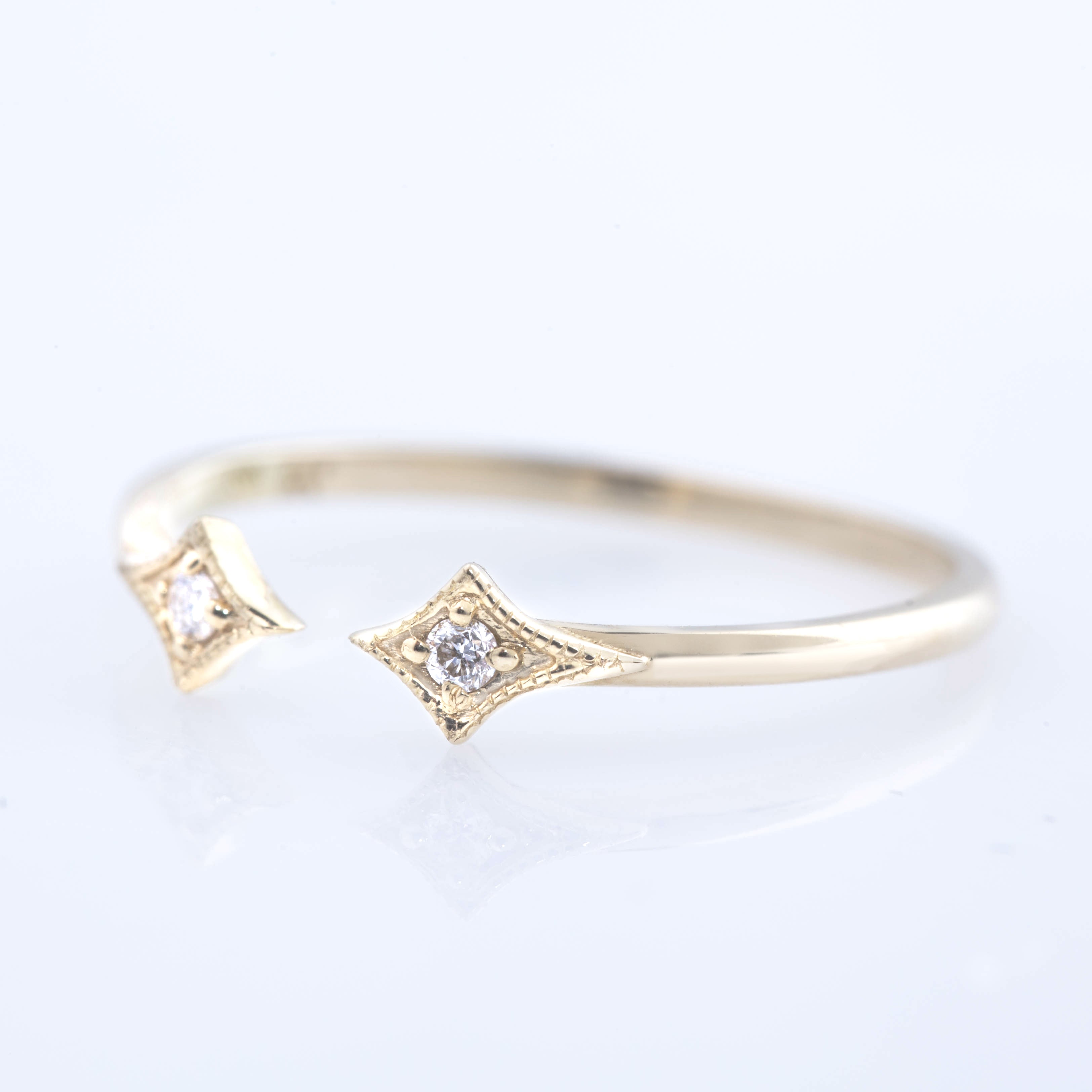 Delicate double star open ring with natural white diamonds set in ethically sourced solid gold band