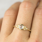 Elegant Faye Ring with 4mm rose cut diamond and six decorative melee diamonds in 14k yellow gold band.