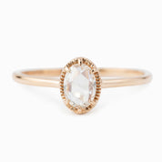 Oval rose cut diamond ring with six-prong rose gold bezel setting and tapered recycled metal band
