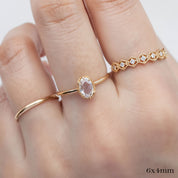 Oval rose cut diamond ring with gold tapered band, low profile six prong bezel setting, worn on hand