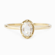 Oval rose cut diamond ring set in a recycled solid gold tapered band with a low profile six prong bezel setting.