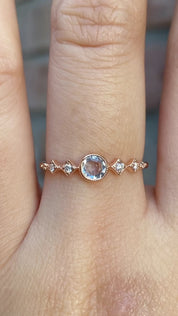 Celeste Ring, 0.25ct Unheated Sapphire in 14k rose gold setting on a hand