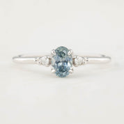 Estel Ring featuring a 0.60ct blue-green oval Montana sapphire and natural diamond accents in 14k white gold