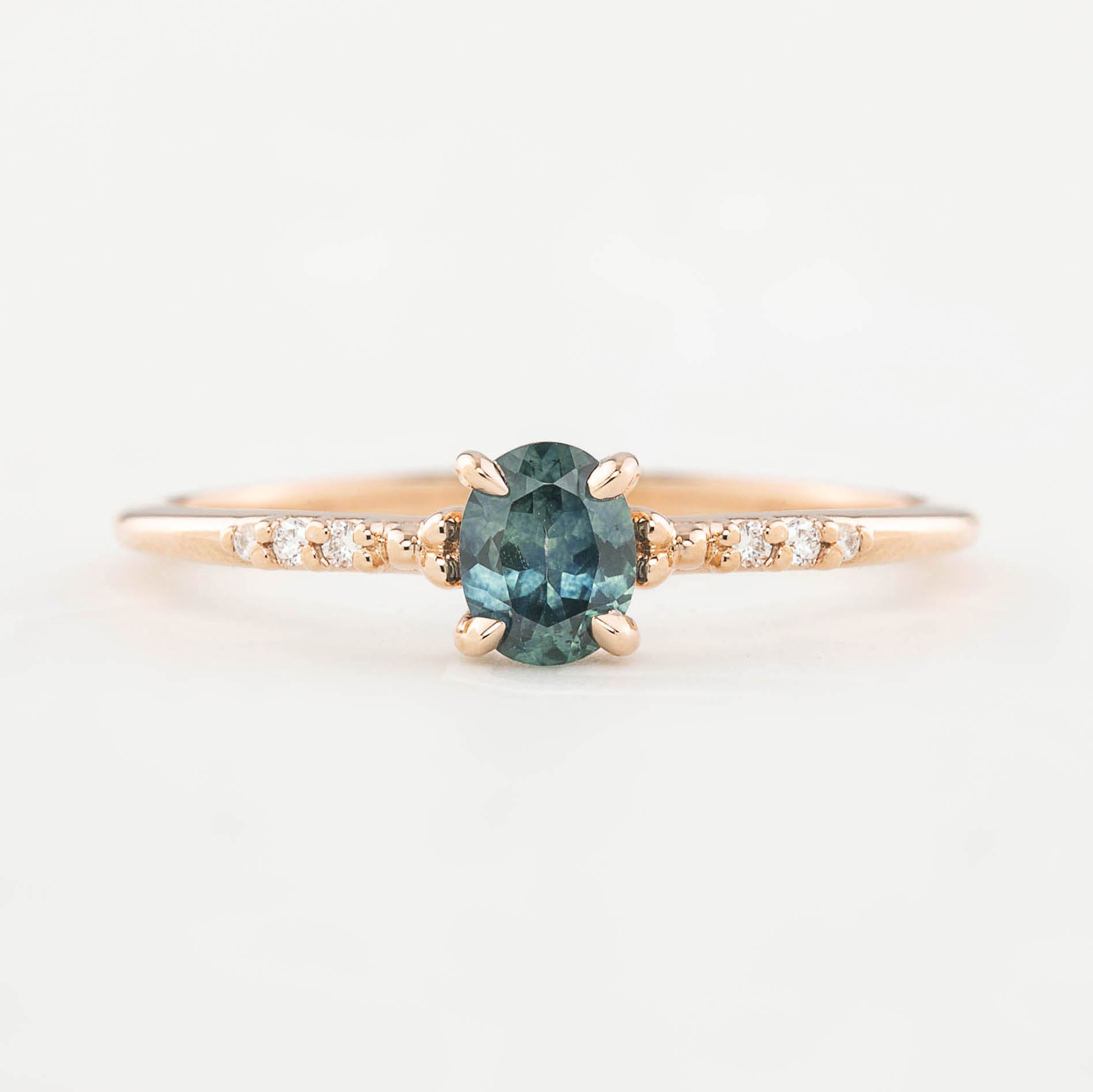 Eloise Ring with a 0.45ct oval Montana sapphire and diamond pave band in 14k rose gold