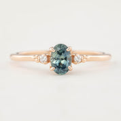 Estel Ring featuring a 0.60ct blue-green oval Montana sapphire and natural diamond accents in 14k rose gold