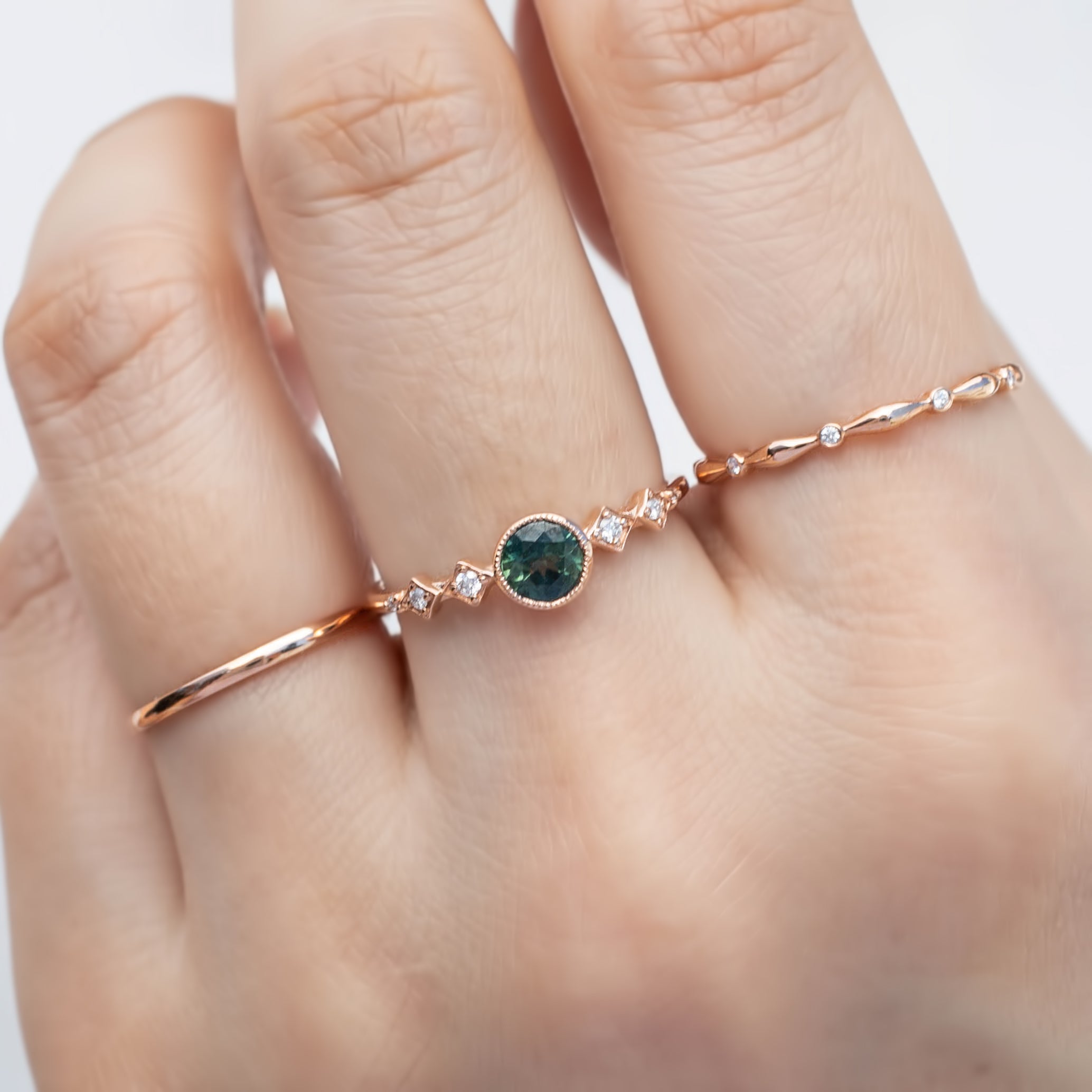 0.50ct green Queensland Sapphire Ring in 14k rose gold on finger