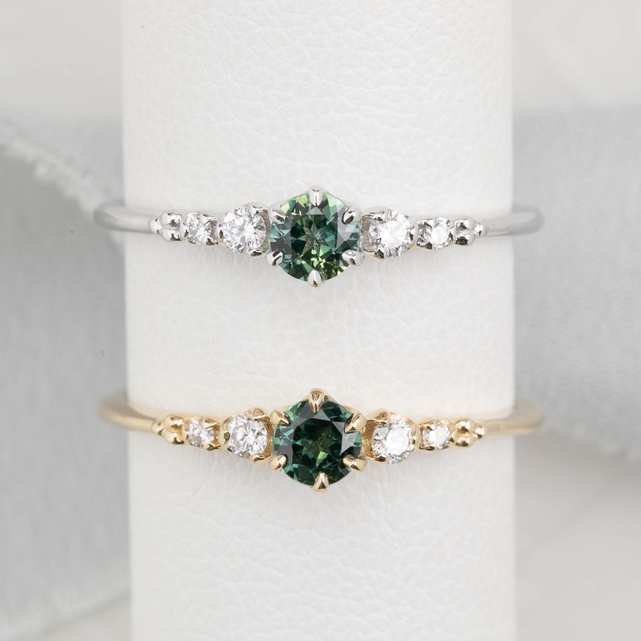 Estel Fleur Ring with a 0.30ct round deep blue Queensland sapphire and natural diamond accents in 14k white gold and 14k yellow gold