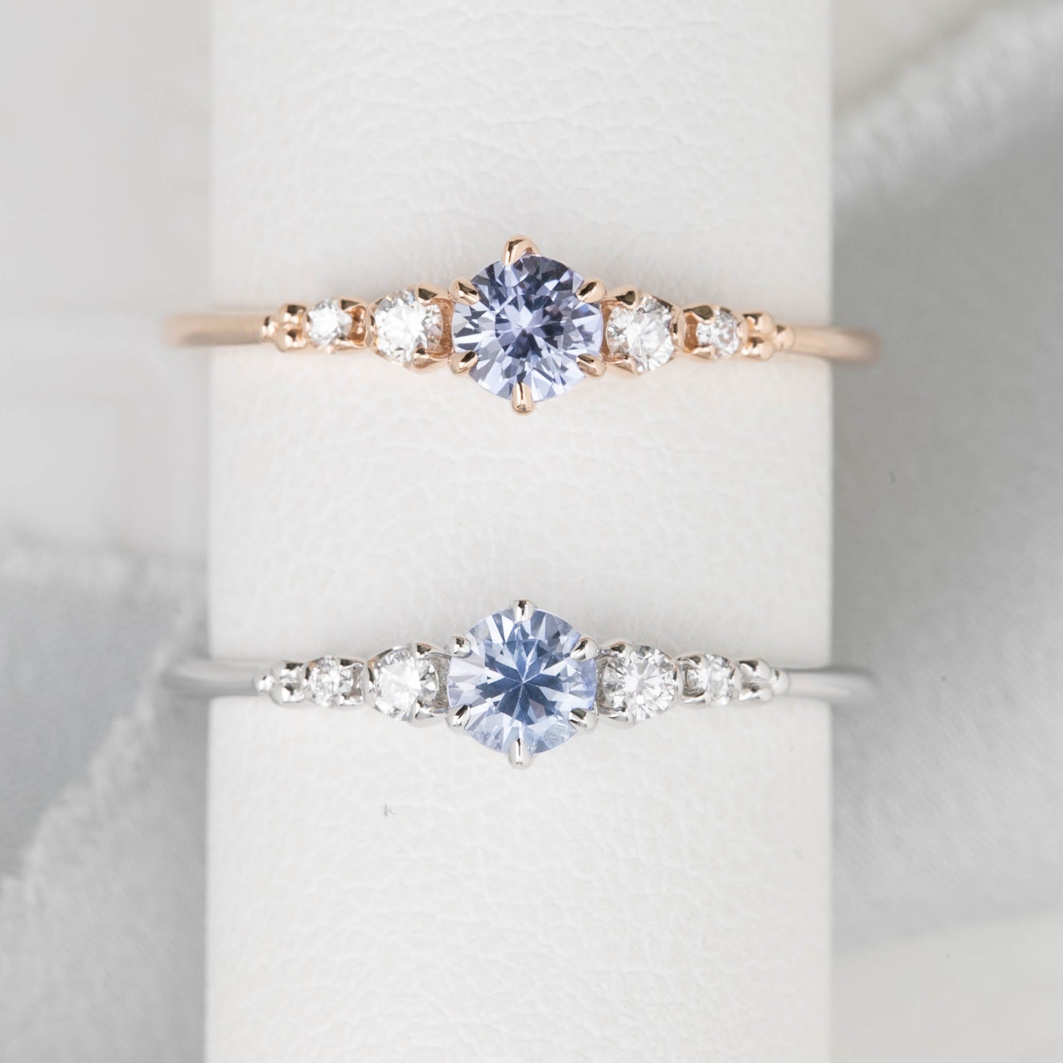 Estel Fleur Ring with a 0.30ct round blue Ceylon sapphire and natural diamond accents in 14k rose gold and 14k white gold