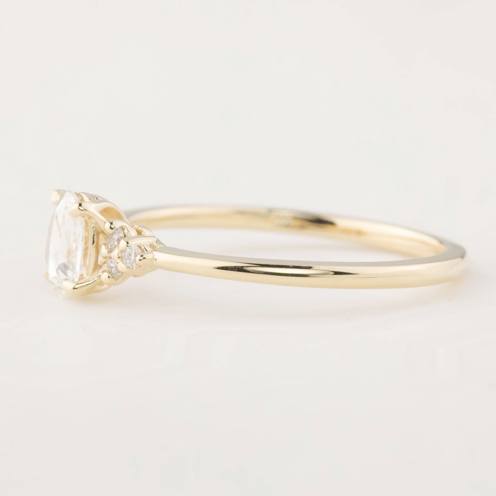 14k yellow gold Teresa Ring with 0.45ct oval rose cut diamond and white accent diamonds in flower setting