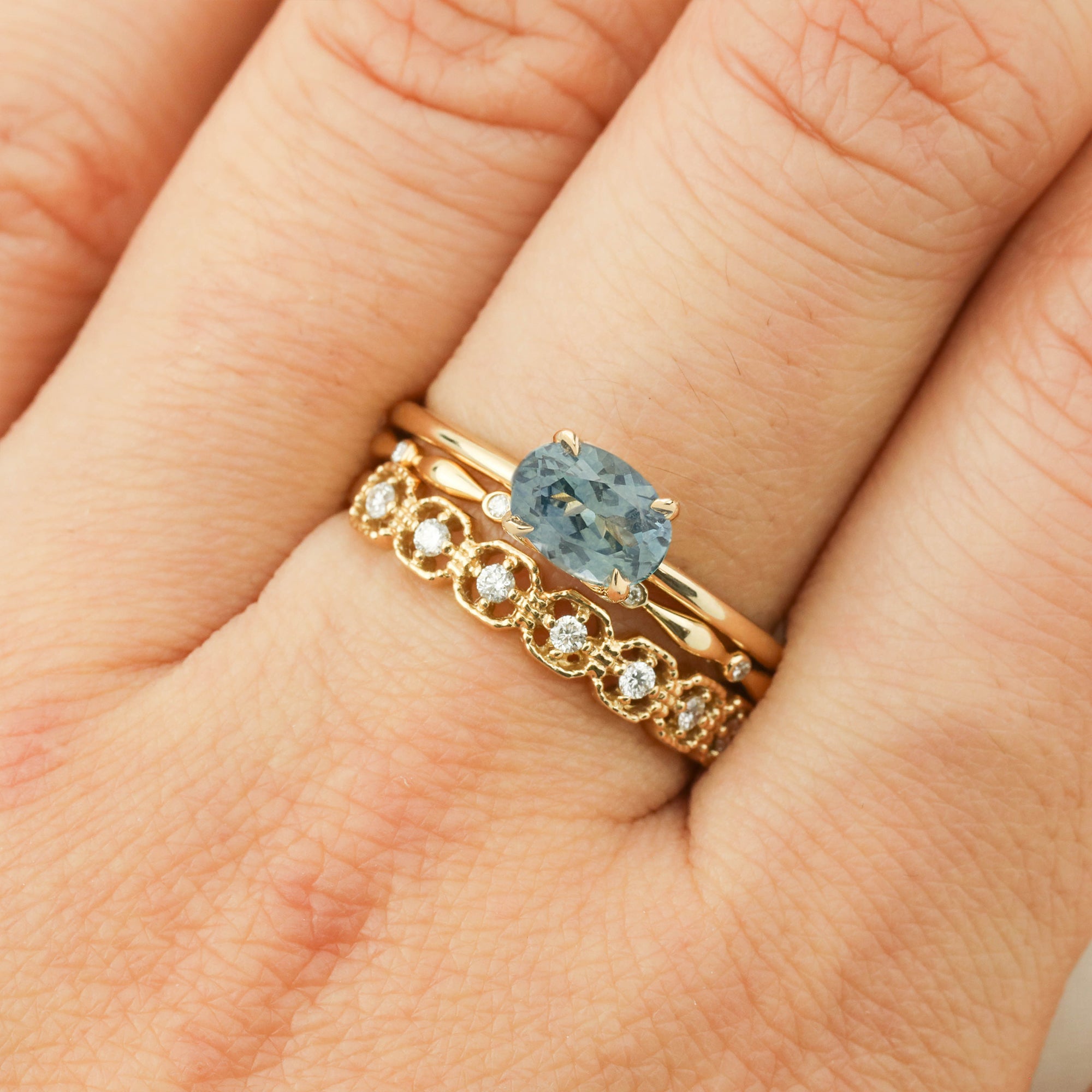 Sara Ring -1.05ct Blue Green Montana Sapphire, handmade in recycled 14k gold with ethically sourced stones on finger