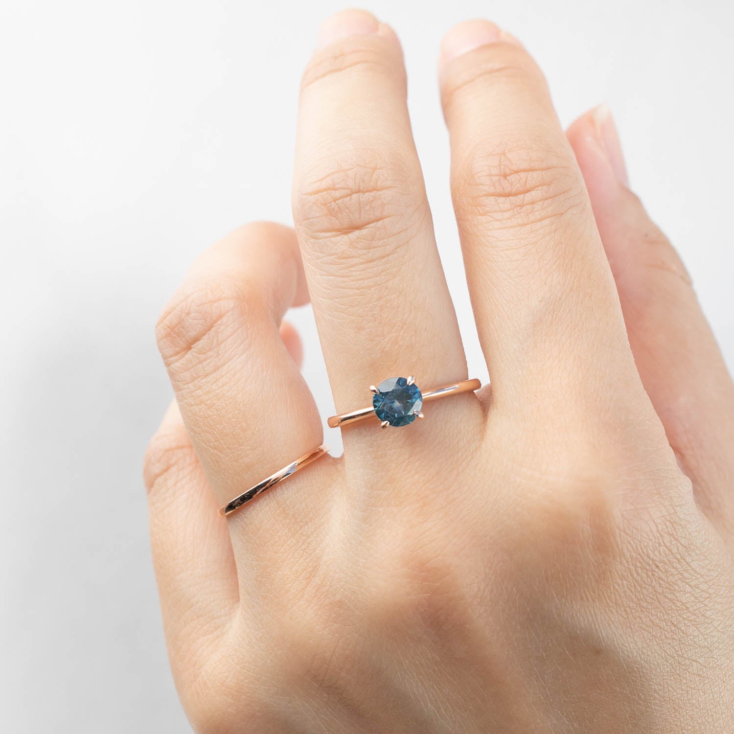 Jane Ring featuring 1.09ct teal-blue Montana sapphire set in 14k rose gold, handmade and ethically sourced design.