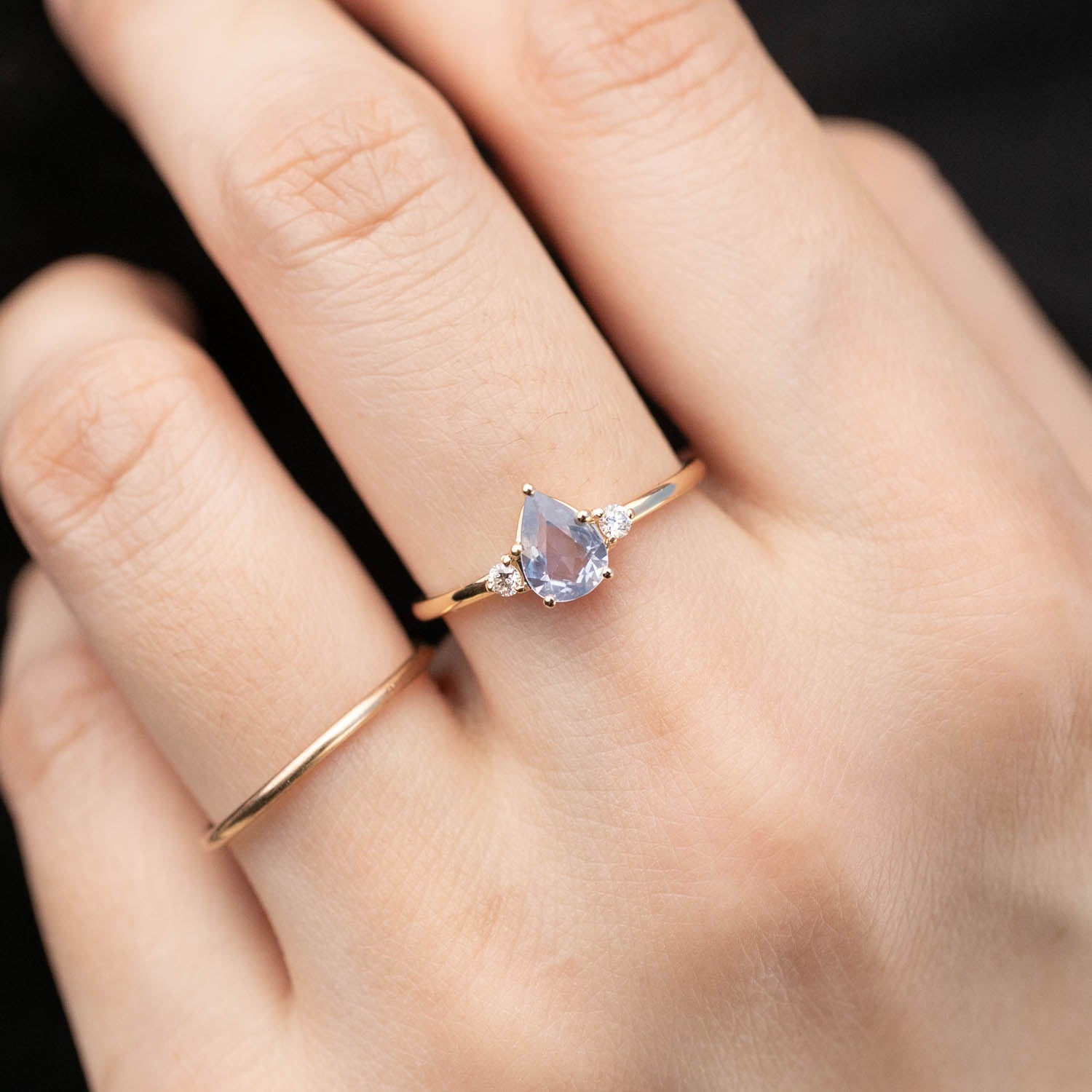 Emilie Ring featuring unheated blue teardrop sapphire and diamonds in 14k recycled rose gold, handmade and authentic