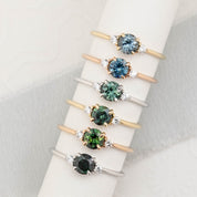 Six Emilie Ring featuring a 0.60ct round sapphires in 14k yellow gold, rose gold and white gold
