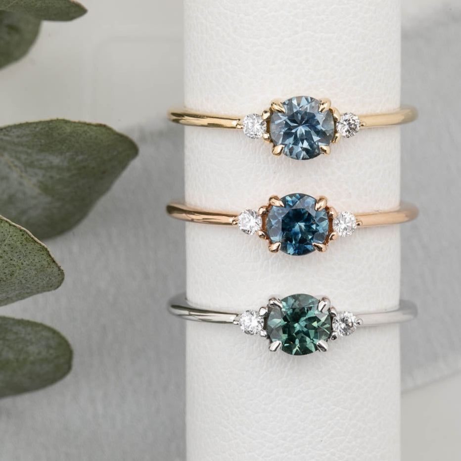 Emilie Ring featuring a 0.60ct round Montana sapphire in 14k yellow gold, rose gold and white gold.