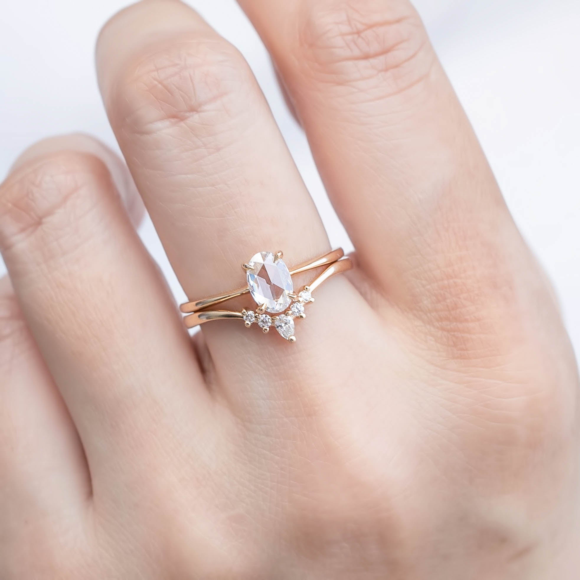 Nina Ring with 0.48ct oval rose cut diamond in 14k yellow gold, handmade and ethically sourced, worn on hand.