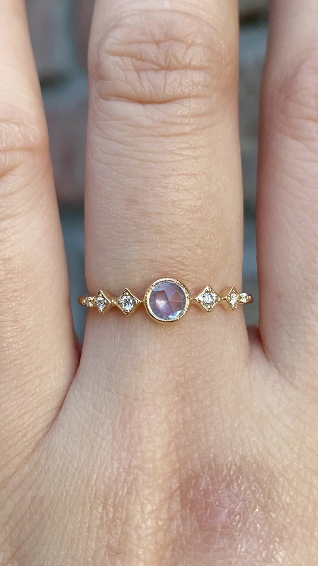 Celeste Ring, 0.25ct Unheated Sapphire in 14k yellow gold setting on a hand