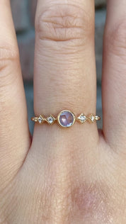 Celeste Ring, 0.25ct Unheated Sapphire in 14k yellow gold setting on a hand