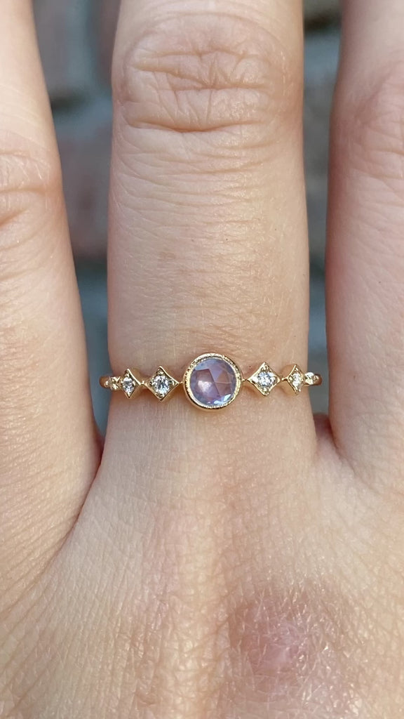Celeste Ring, 0.25ct Unheated Sapphire in 14k yellow gold setting on a hand