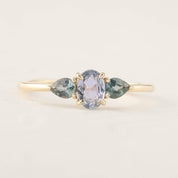 Blue sapphire three stone ring with teardrop peacock sapphires set in recycled 14k gold low profile band