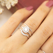 Hand wearing the Half-Round Straight Band (1.3mm) along with two delicate diamond rings from Envero Jewelry.