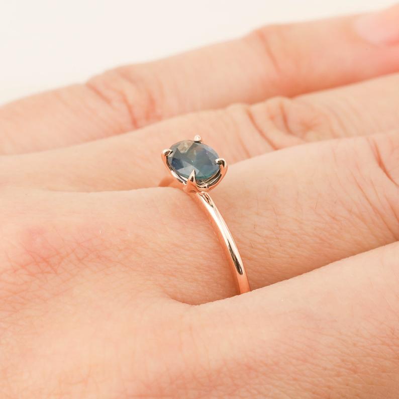 Sara Ring featuring 1.00ct green Montana sapphire in 14k rose gold with high profile flower setting on finger