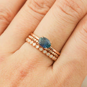 Close-up of Sara Ring featuring 1.00ct green Montana Sapphire in 14k rose gold with diamond accent bands.