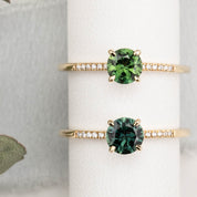 Audrey Ring, 0.73ct Queensland Sapphire with a green gemstone on a white background