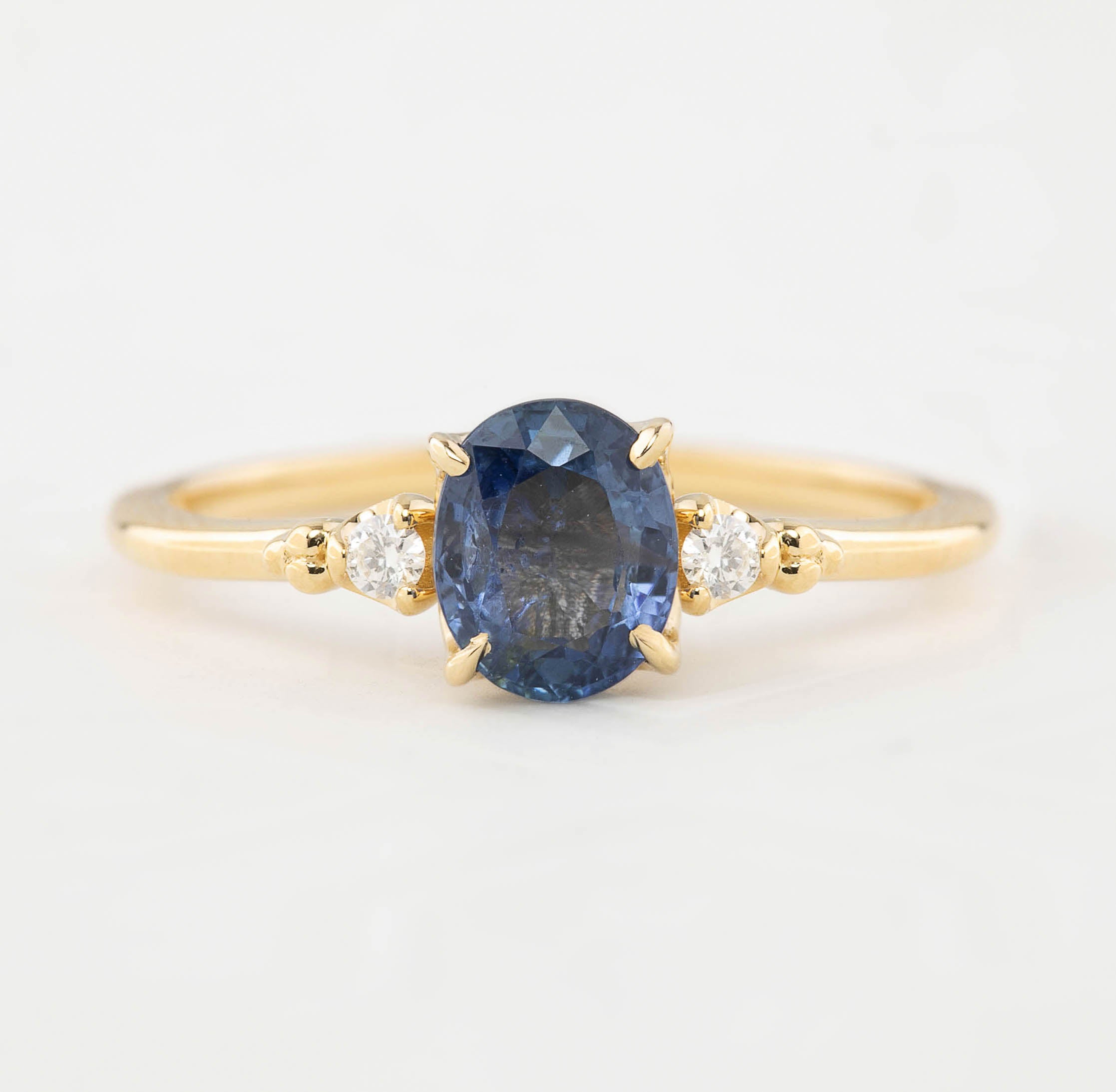 Estel Ring one of a kind 1.05ct blue sapphire with white accent diamonds in recycled 14k yellow gold band