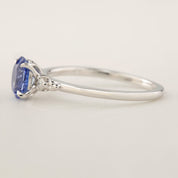 Side view of Estel Ring with 1.01ct Blue Ceylon Sapphire and white gold band in a four-prong flower setting