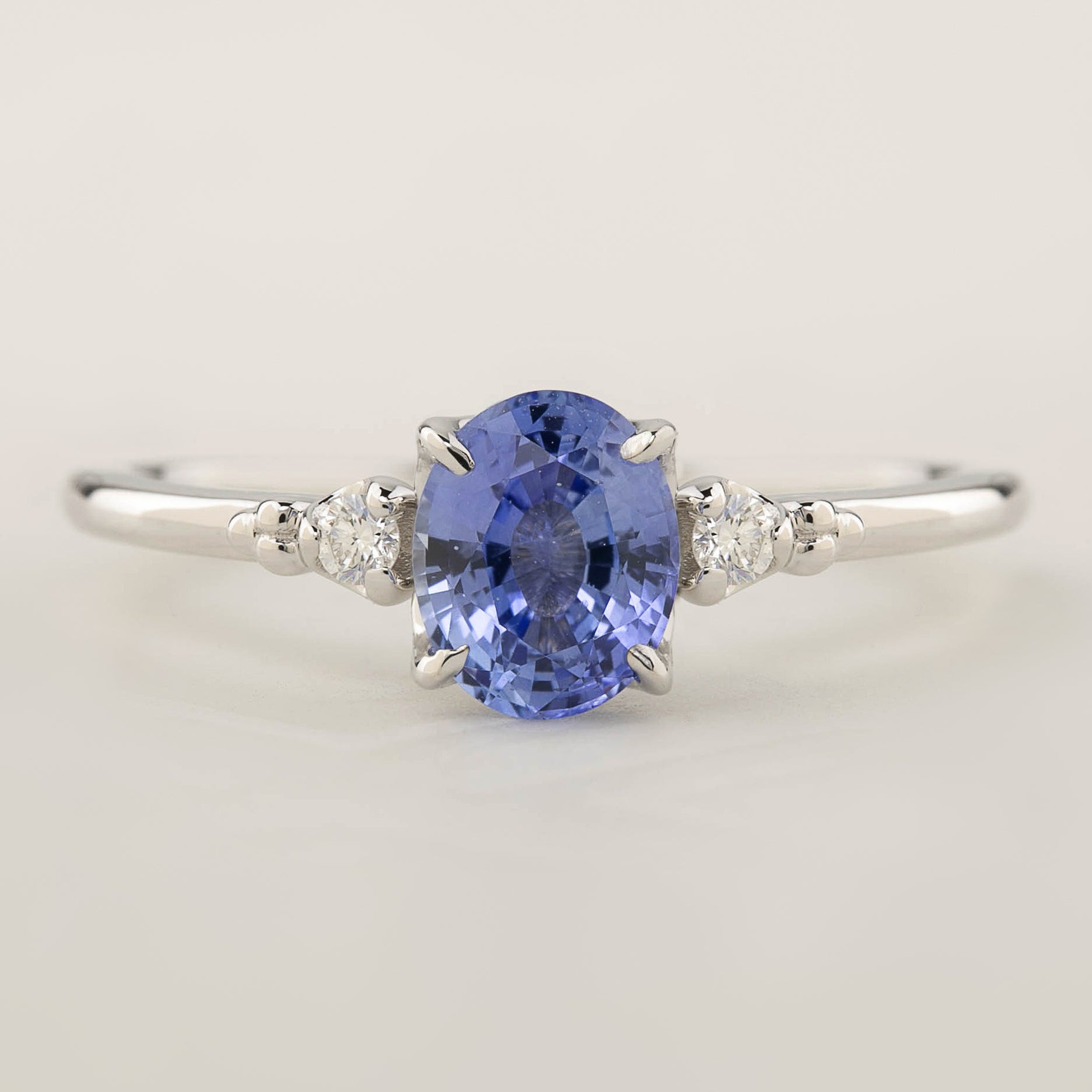 One of a kind Estel ring with 1ct Blue Ceylon Sapphire and white accent diamonds in 14k white gold band